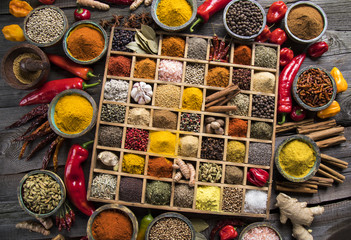 Wooden box with spices and herbs