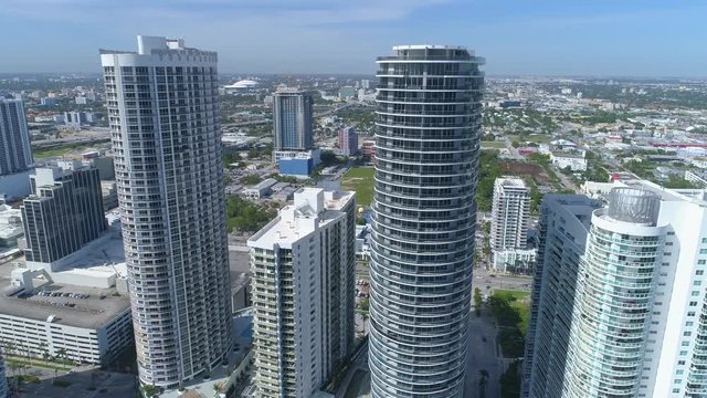 Fast aerial flyover and tilt down highrise building