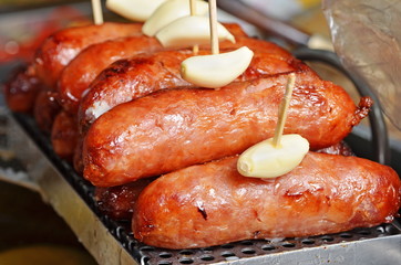 Close up of Chinese-style sausages with garlic           