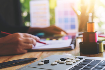 Young woman dressmaker or designer working as fashion designers and drawing sketches for clothes and choose color bar in tablet, profession and job occupation, Fashion Designer Stylish Concept