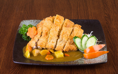 japanese cuisine. fried chicken curry on the background