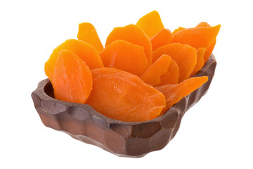 Dried mango fruit slices In a wooden tray isolated on white background