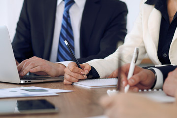 Group of business people or lawyers  at meeting, hands close-up