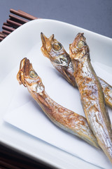 japanese cuisine. fried fish on the background