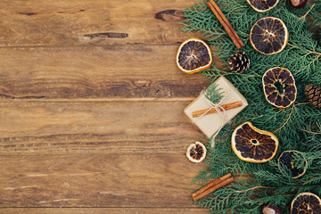 Christmas vintage background with fir branches on wooden table. Top view, copy space
