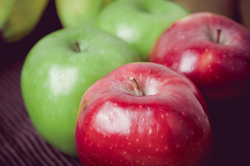 Green and red of apples on  black background