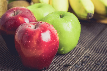 Green and red of apples on  black background