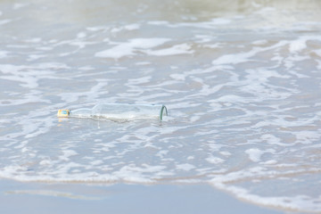 Empty bottle on the beach