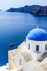 Fototapeta na wymiar Oia, Santorini, Greece - Blue church and caldera