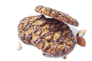 a bunch of sweet oatmeal crispy cookies with chocolate and nuts close