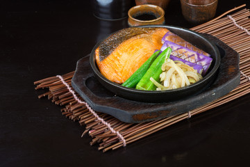 japanese cuisine. hot plate fish on the background