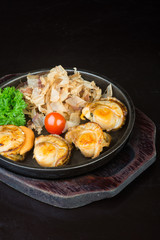 japanese cuisine. grilled shell fish on the background