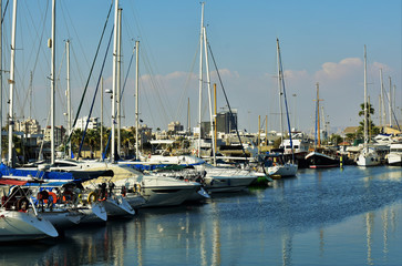 Fototapeta na wymiar Marina bay with moored sailboats, Cyprus.