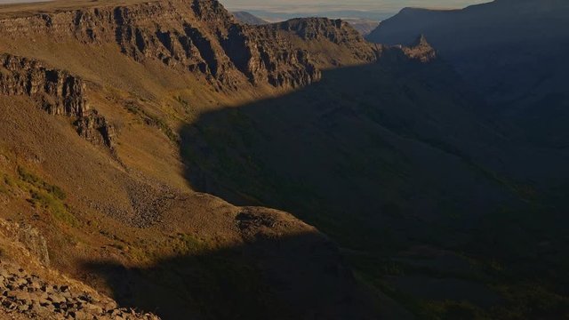 Light reveals desert canyon scoured by glaciers at sunrise Kiger Gorge summit of Steens Mountain near Malheur National Wildlife Refuge