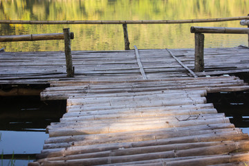 Fototapeta premium Waterside wood pier made of bamboo