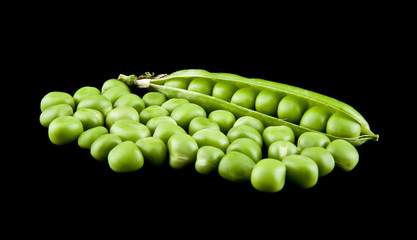 green peas on a black background close-up