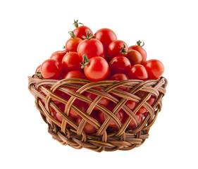 tomatoes in a basket isolated on white background close-up