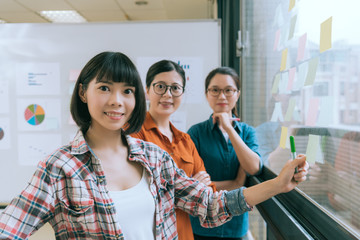 Obraz premium smiling business manager with her working team.