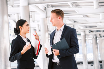 Image two business partners talking and working together