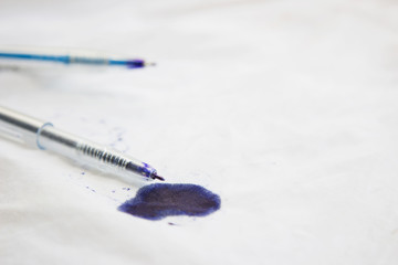 Leaking ink stain on white shirt, daily life dirty stain concept 