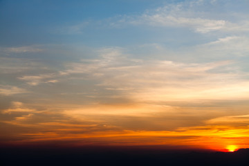 colorful dramatic sky with cloud at sunset.