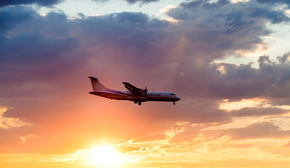 Fototapeta na wymiar Passenger jet plane in the sky. Airplane flies high above the clouds.