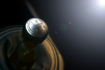 Close up view of a gear lever shift. Manual gearbox. Car interior details. Car transmission. Soft...