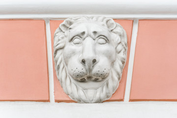 White lion bas-relief on the facade of the building