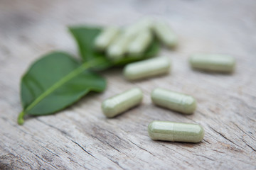 Herbal medicine in capsules from organic herb for healthy eating 