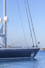 Obraz premium Boat side luxury docked on marine harbor port with clean sky background