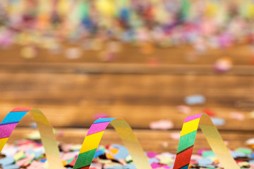confetti and streamer wooden background