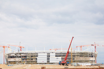 Cranes at work . Stadium construction. construction of sports facilities