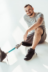 smiling man with leg prosthesis