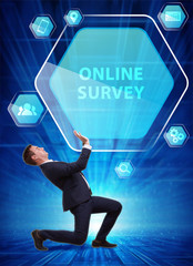 Business, Technology, Internet and network concept. Young businessman working on a virtual screen of the future and sees the inscription: Online survey