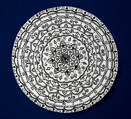 Mandala flower black and white on blue background