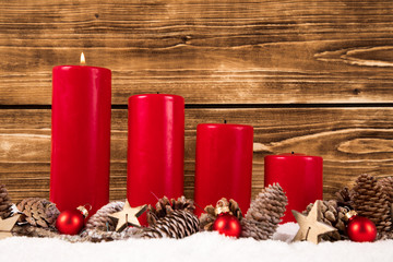 first advent with one red burning candle