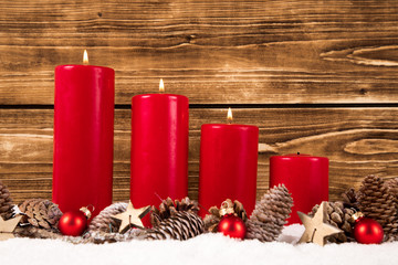 third advent with three red burning candles