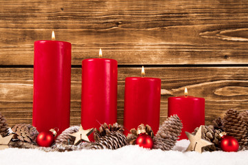 fourth advent with four red burning candles