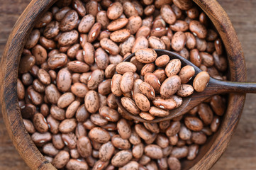 Pinto bean in wooden bowl for background 