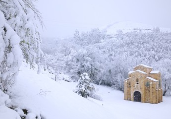 Abandoned building in snowy forest