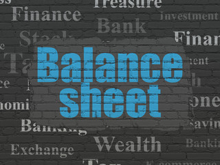 Banking concept: Painted blue text Balance Sheet on Black Brick wall background with  Tag Cloud
