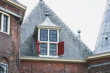 Architectural details on the medieval building in Amsterdam, Holland, Europe.