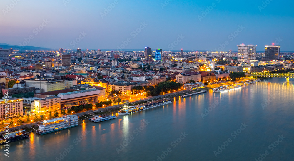 Wall mural aerial view of the old town in bratislava, new bridge over danube river with evening lights in capit - Wall murals