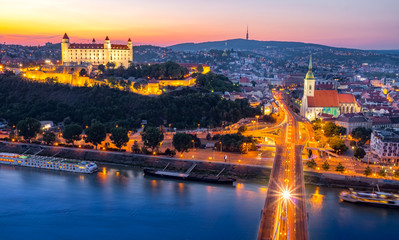 Aerial view of Bratislava castle,Parliament and the New bridge over Danube river with evening lights in capital city of Slovakia,Bratislava