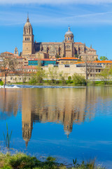 View of the cathedral of Salamanca reflected in the river, spain