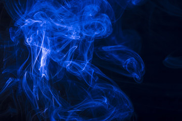 Blue smoke on black background
