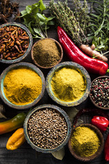 Variety of spices and herbs on kitchen table