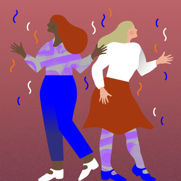 Two women dancing in confetti