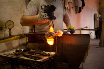 Glassworks glass manufacturing, process of forming a decorative vase  - obrazy, fototapety, plakaty