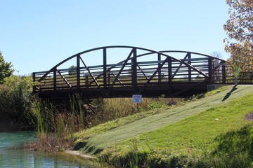 The metal bridge in the park on a close up view.